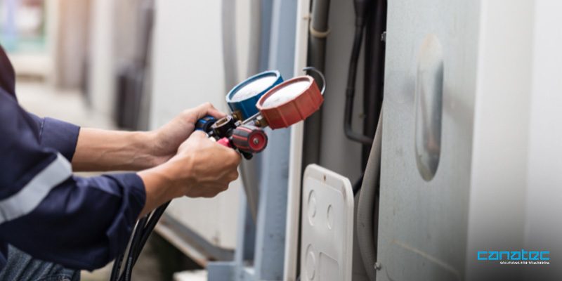 An expert checking the airflow of the fan wall unit